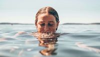 Wild swimmer in water.