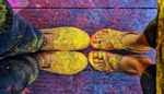 Feet and shoes of colour Festival goers.