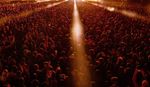 Beams of stage lights over large crowd at Field Day Festival.