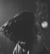 Woman in cabaret dancing with hair swinging out.