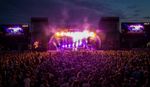 Crowd in front of the main stage at night at Splendour Festival, UK.