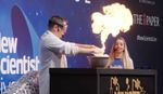 Science performance at the New Scientist Live Festival, performer creating ball of fire out of a bowl.