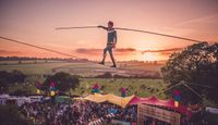 Performer walking a tight rope at Shindig Festival 2017.