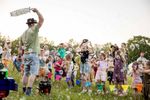 Children reaching for bubbles during a group activity at Elderflower Fields Festival 2026. Photograph: Richard Murgatroyd.