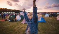 Festival goer dancing freely.