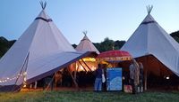 Storytelling under teepees at Stealing Thunder Storytelling Festival.