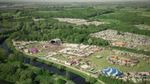 Aerial view of the Bearded Theory Festival site, with stages, tents, campsites and surrounding woodland.