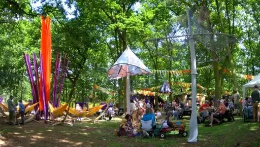 A view of Bearded Theory Festival under the trees.