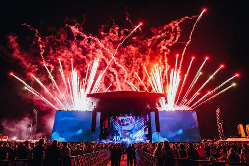 Photo of Reading Festival main stage with fireworks.